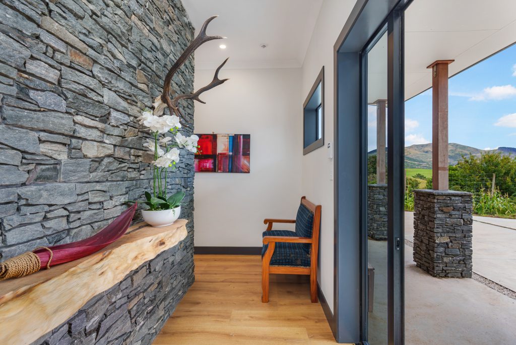 Stone and timber entry of an architectural home